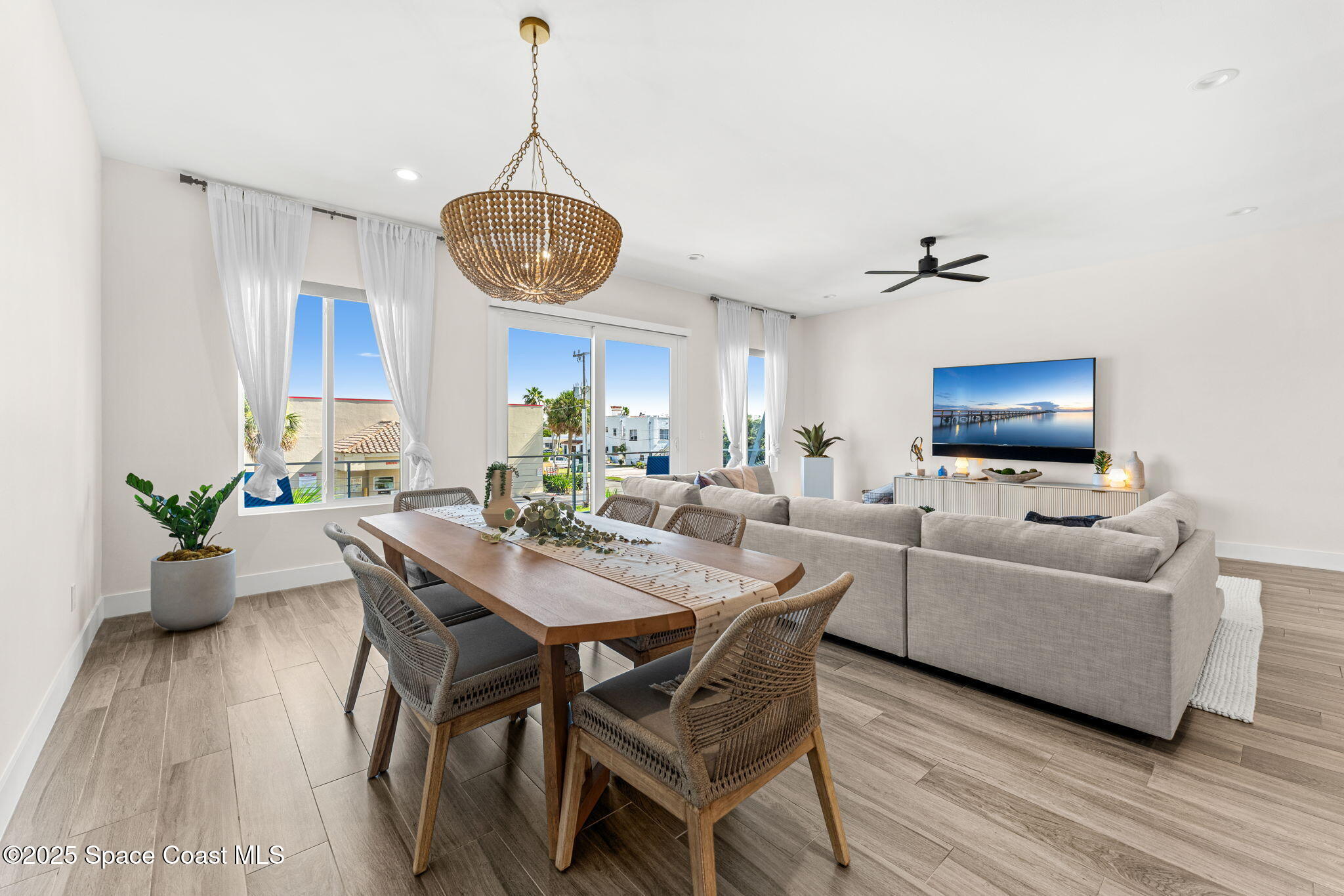 106 4th Avenue Indialantic, FL 32903 - Photo 11 of 37 a view of a dining room with furniture and wooden floor