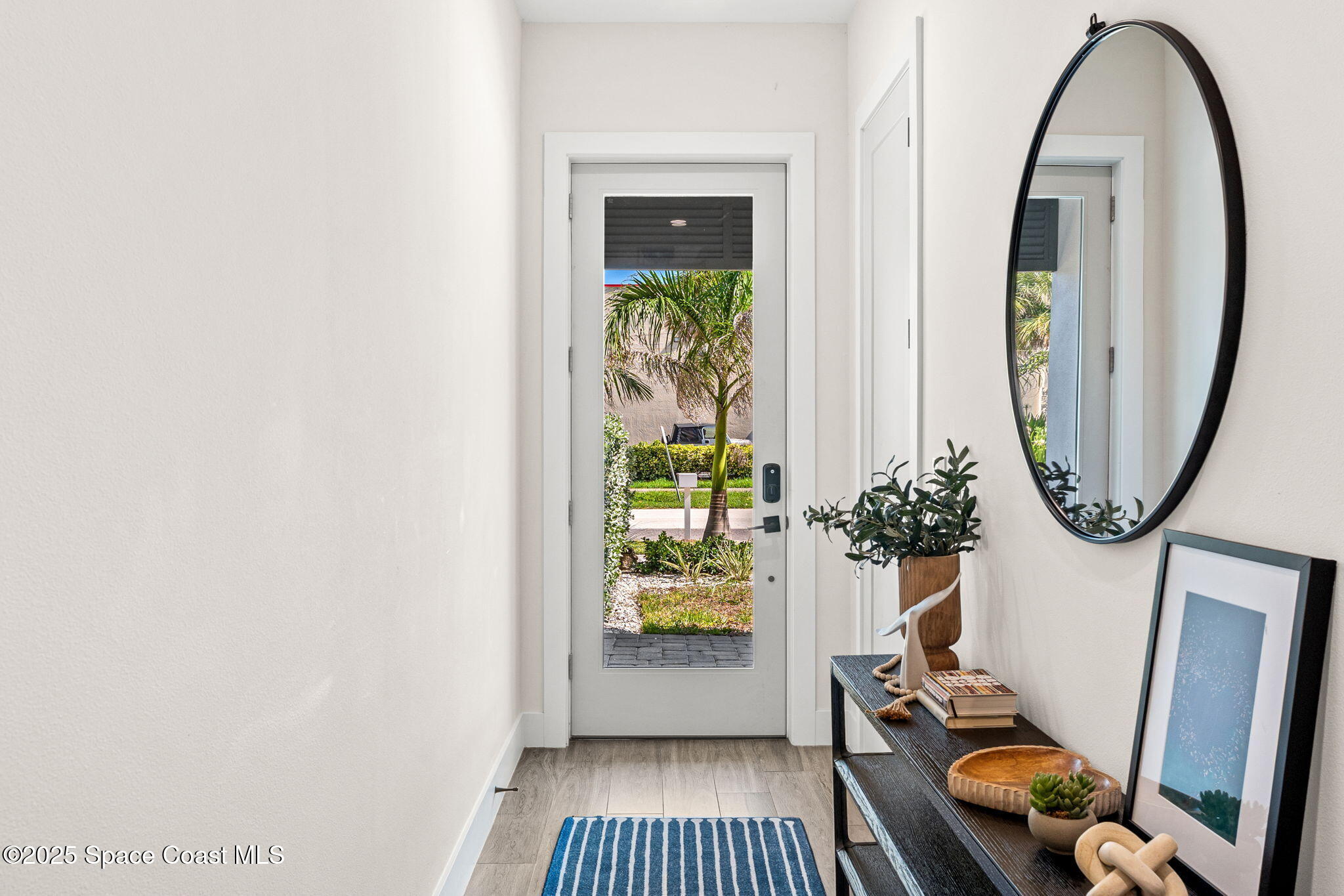 106 4th Avenue Indialantic, FL 32903 - Photo 18 of 37 a view of an entryway with wooden floor