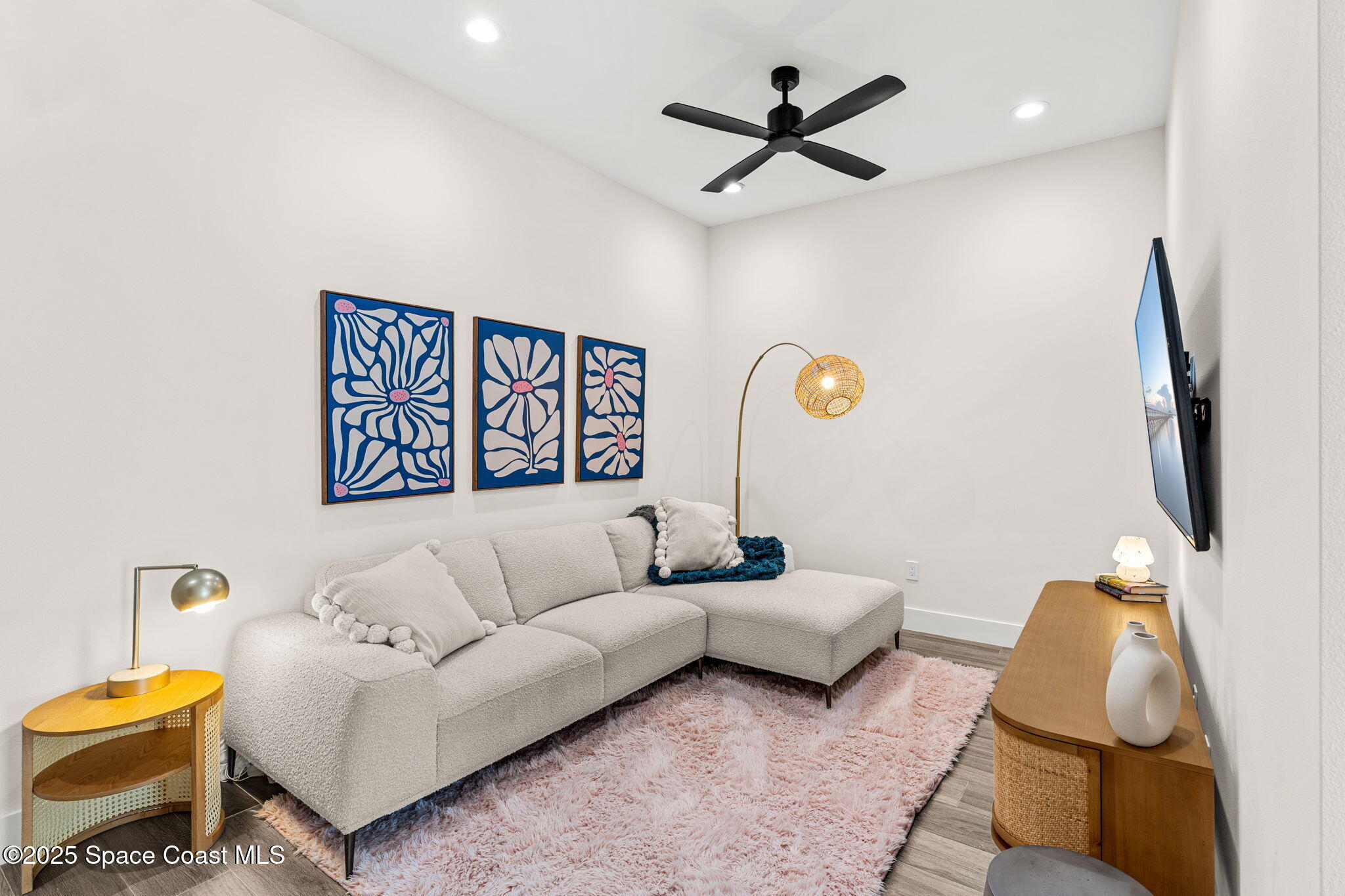 106 4th Avenue Indialantic, FL 32903 - Photo 20 of 37 a living room with furniture and a flat screen tv