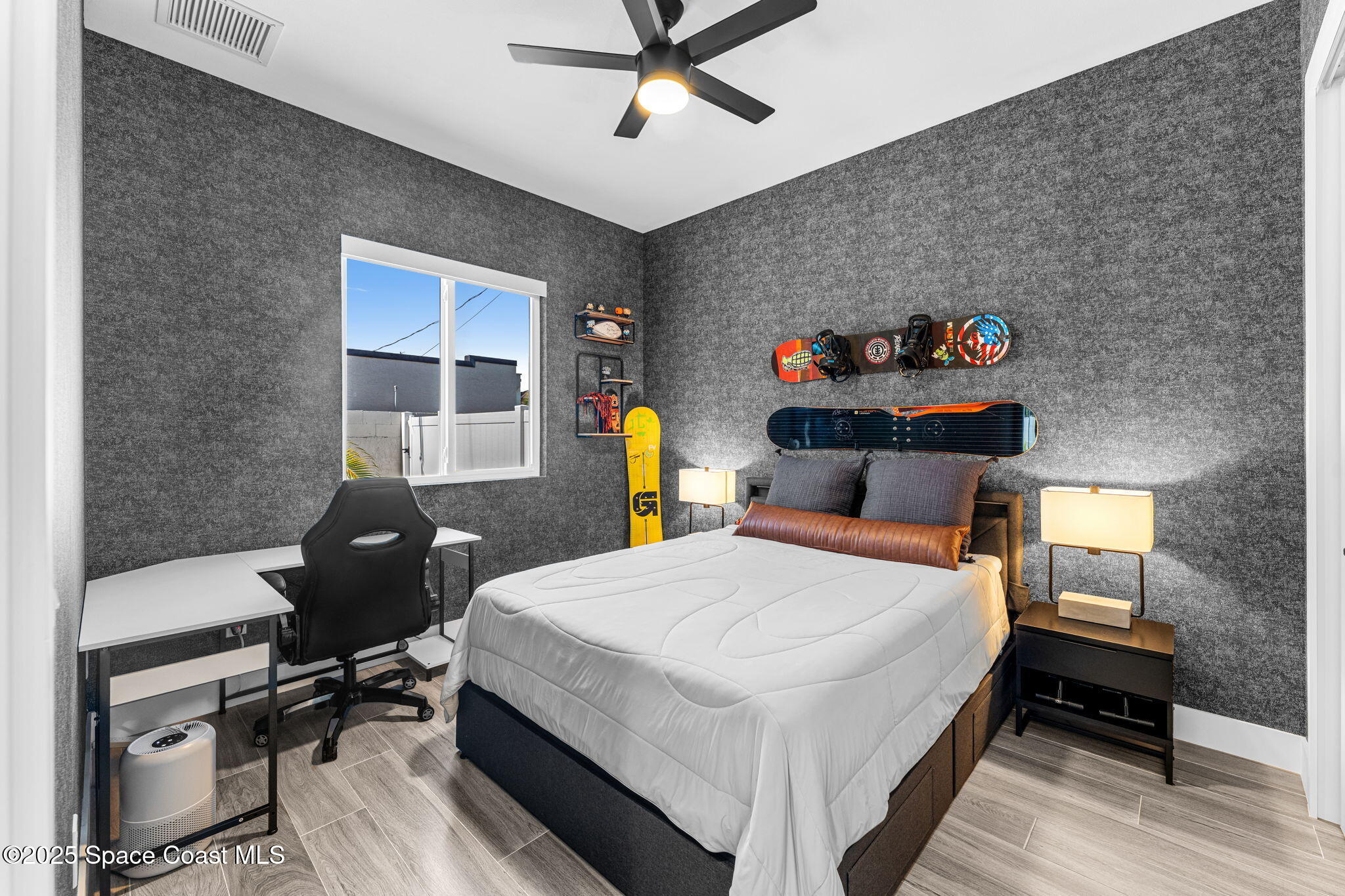 106 4th Avenue Indialantic, FL 32903 - Photo 21 of 37 a bedroom with a bed and a table in it