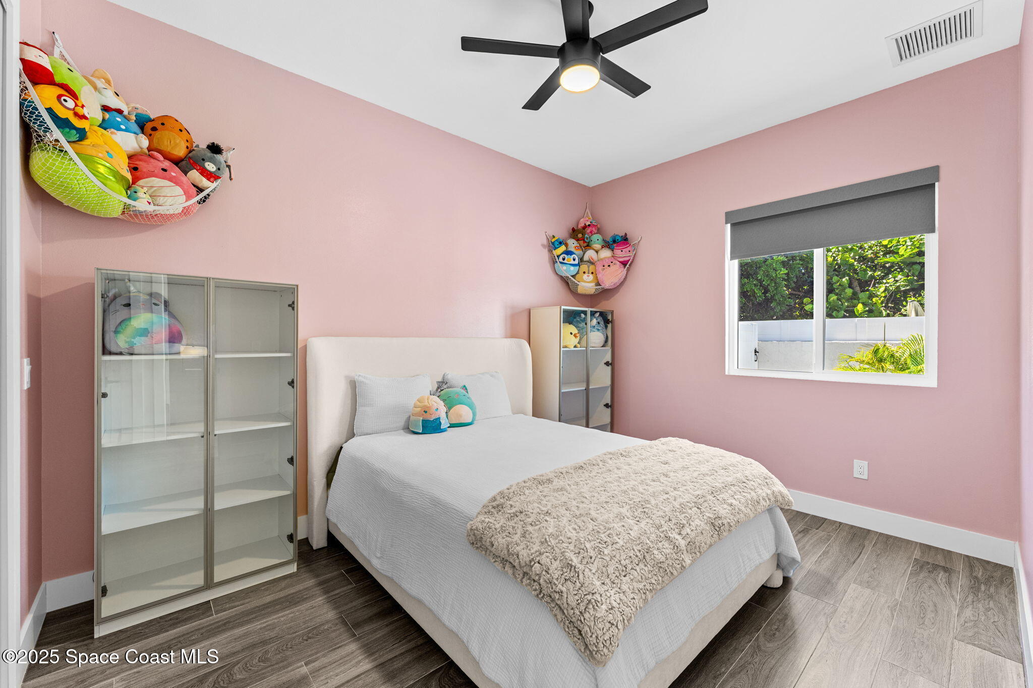 106 4th Avenue Indialantic, FL 32903 - Photo 22 of 37 a bedroom with a bed and a window