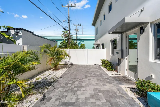 front view of a brick house with a large door