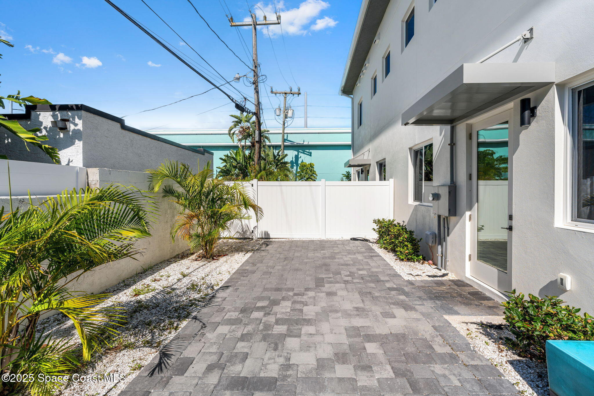 106 4th Avenue Indialantic, FL 32903 - Photo 28 of 37 a view of a house with a yard and potted plants
