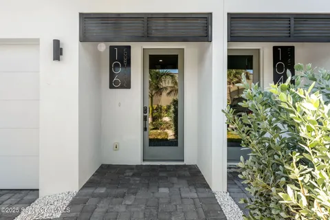 a aerial view of a house with a yard swimming pool and outdoor seating