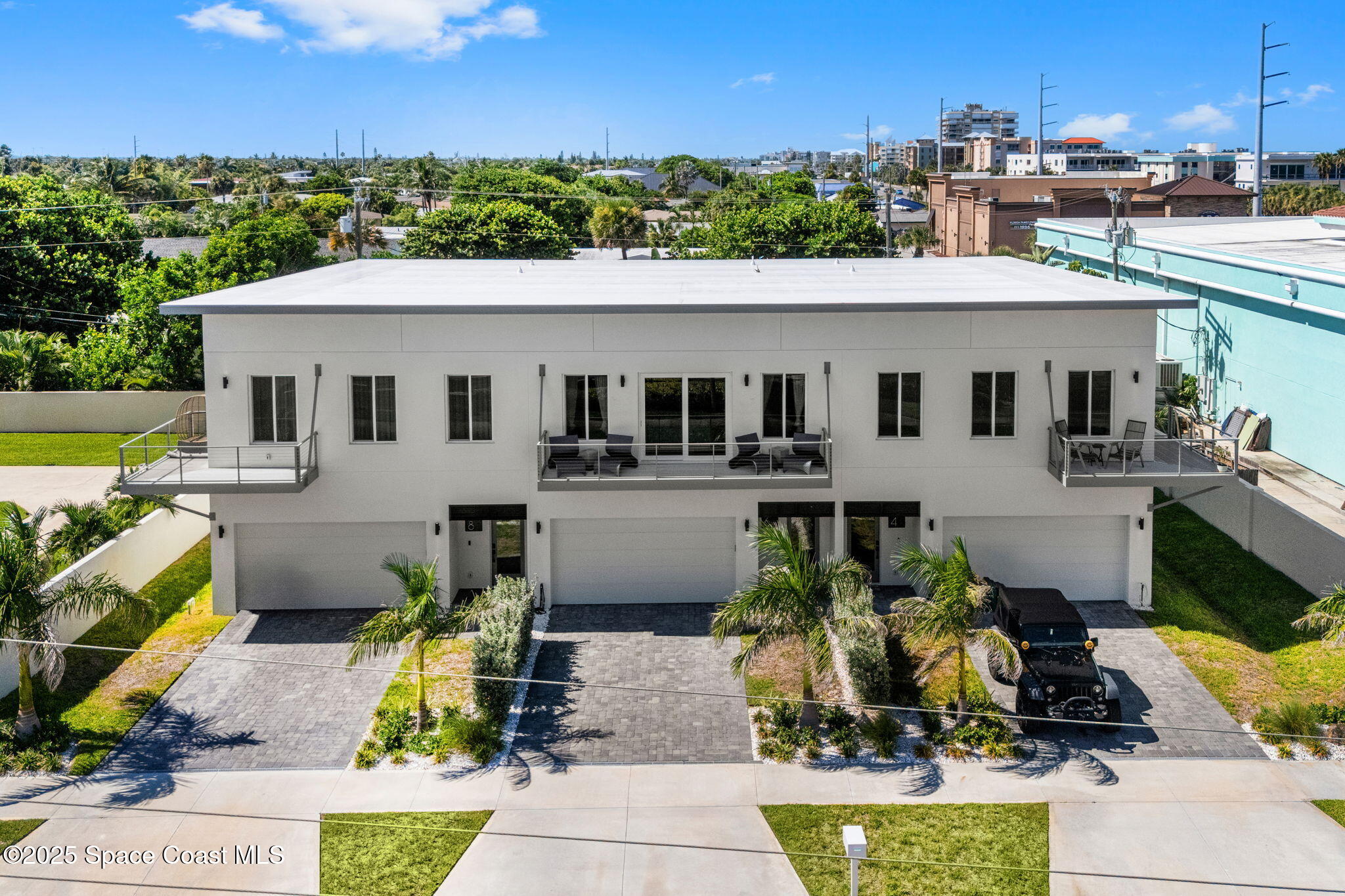 106 4th Avenue Indialantic, FL 32903 - Photo 30 of 37 a aerial view of a house with a yard swimming pool and outdoor seating