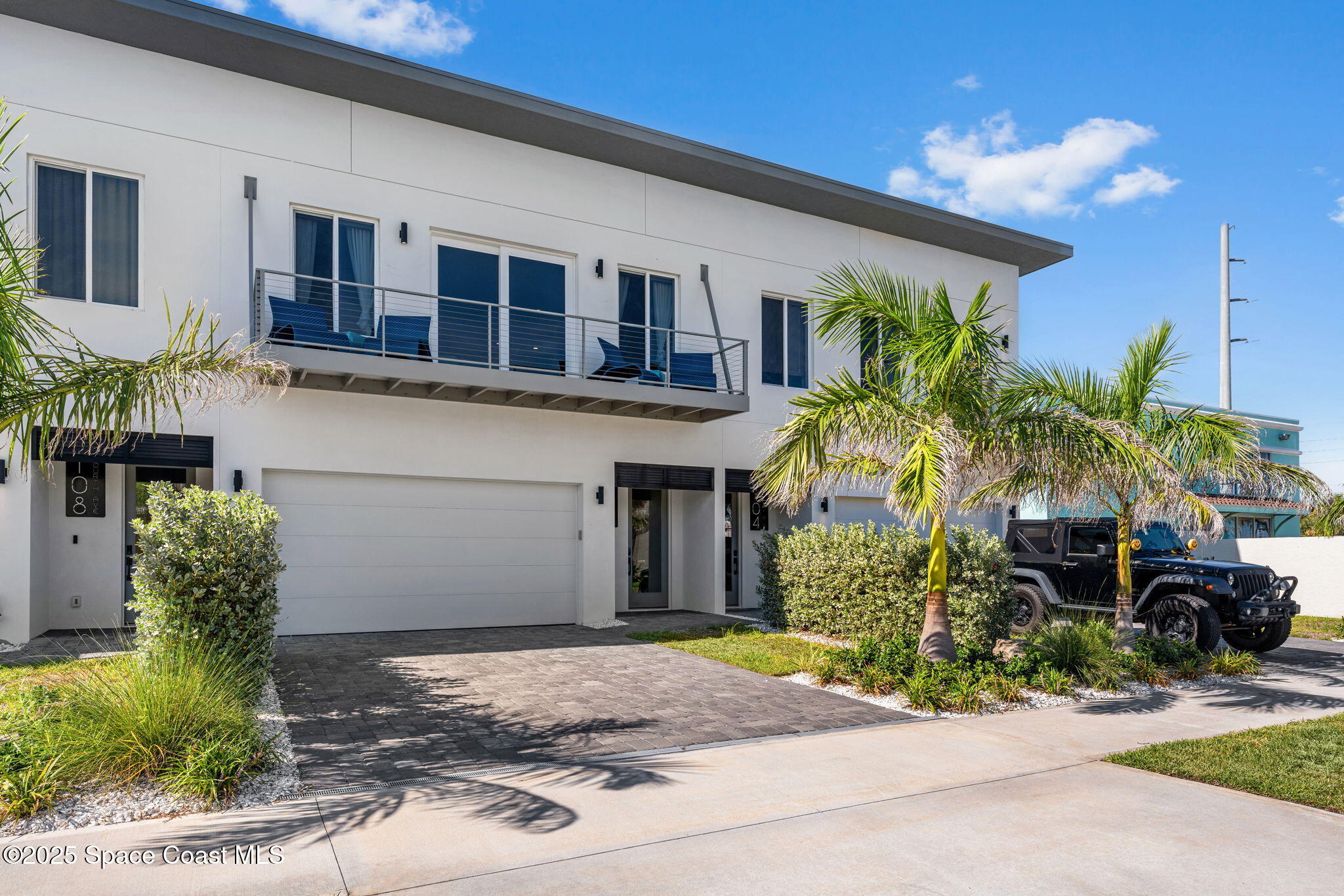 106 4th Avenue Indialantic, FL 32903 - Photo 31 of 37 a front view of a house with garden