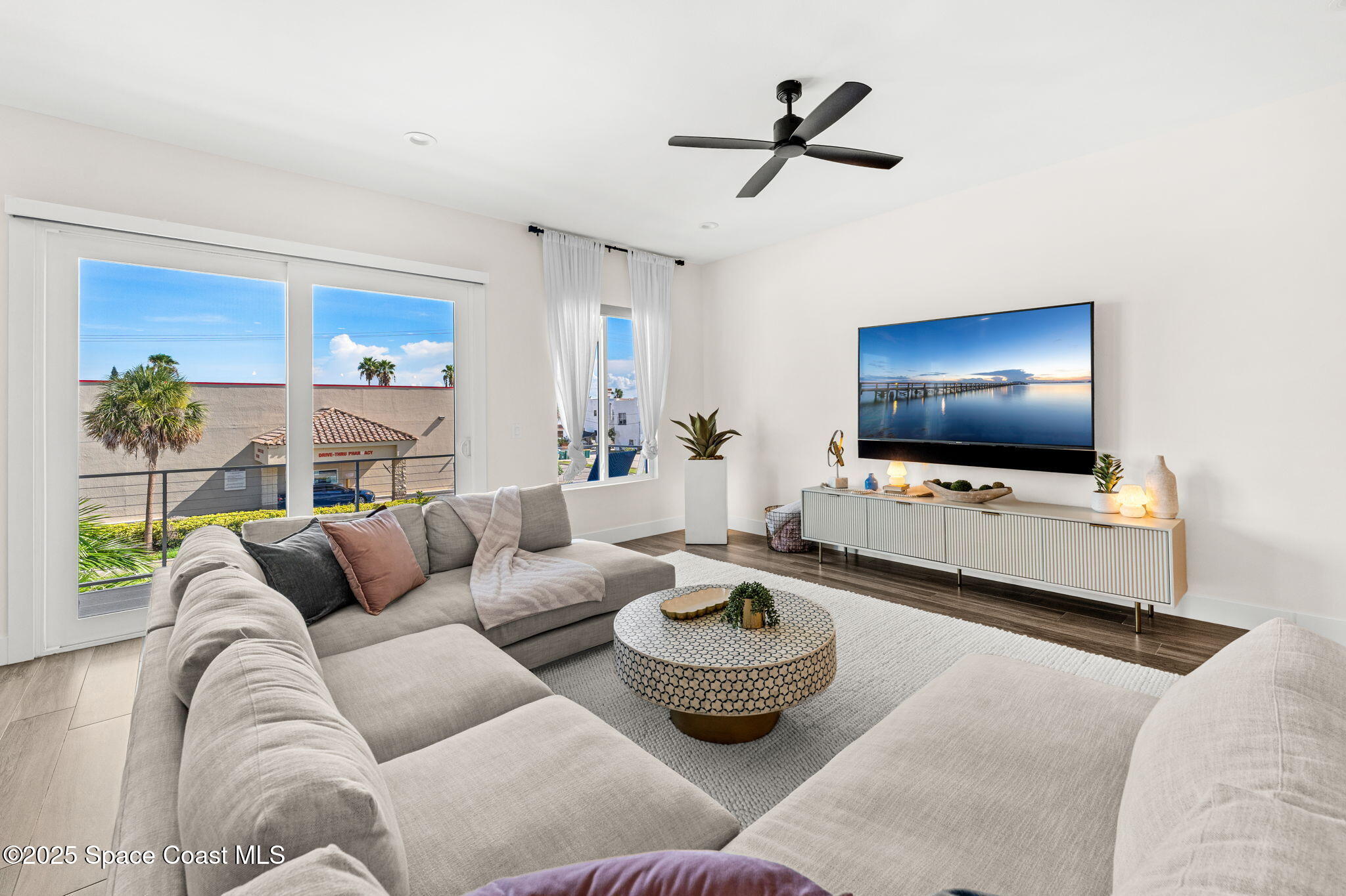 106 4th Avenue Indialantic, FL 32903 - Photo 6 of 37 a living room with furniture and a flat screen tv
