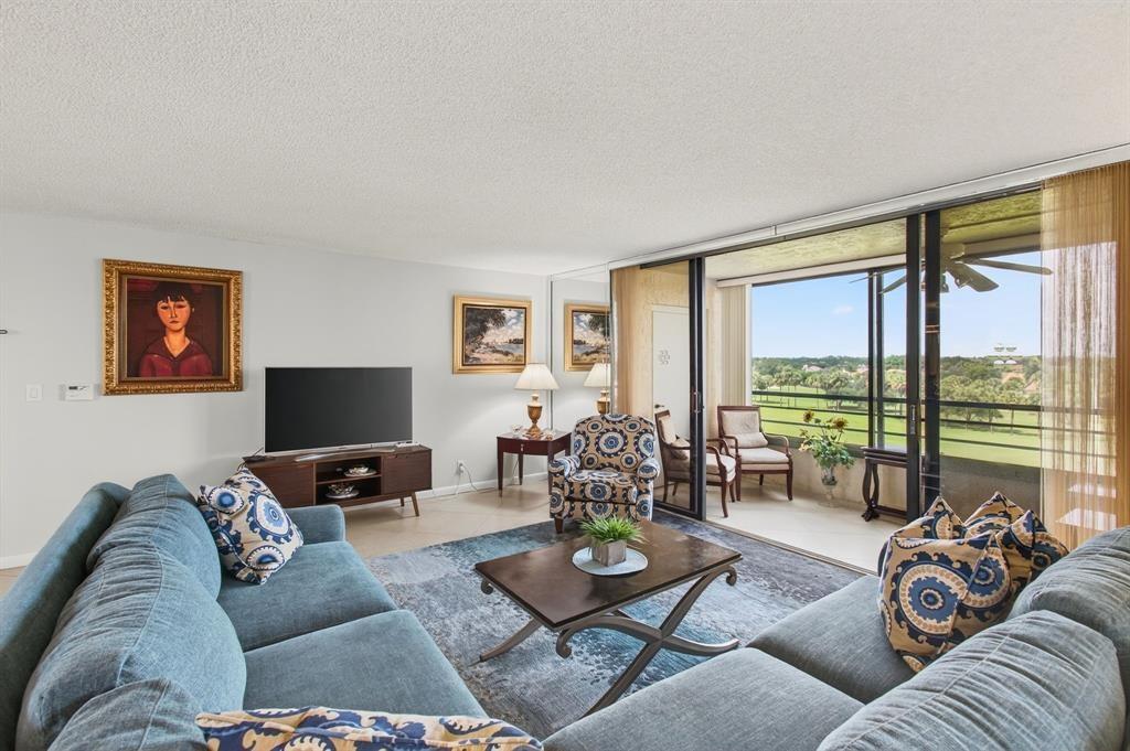7145 Promenade Drive, Unit 602 Boca Raton, FL 33433 - Photo 13 of 90 a living room with furniture and a large window