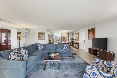 a kitchen with stainless steel appliances granite countertop a sink a stove top oven a counter space and cabinets