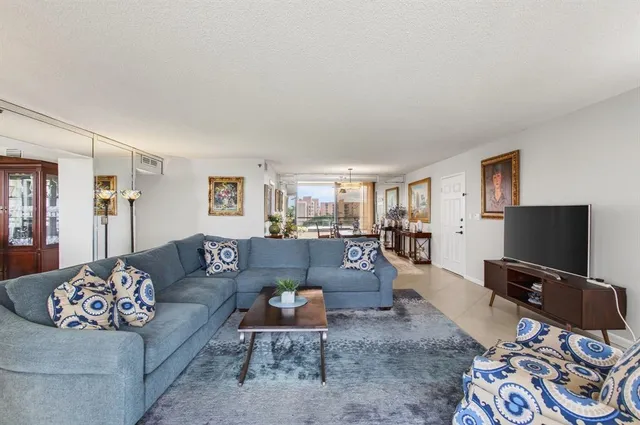 a kitchen with stainless steel appliances granite countertop a sink a stove top oven a counter space and cabinets