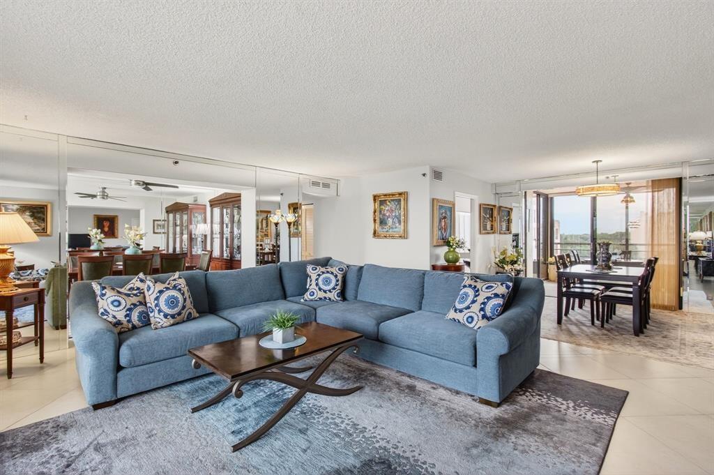 7145 Promenade Drive, Unit 602 Boca Raton, FL 33433 - Photo 23 of 90 a living room with furniture and a large window