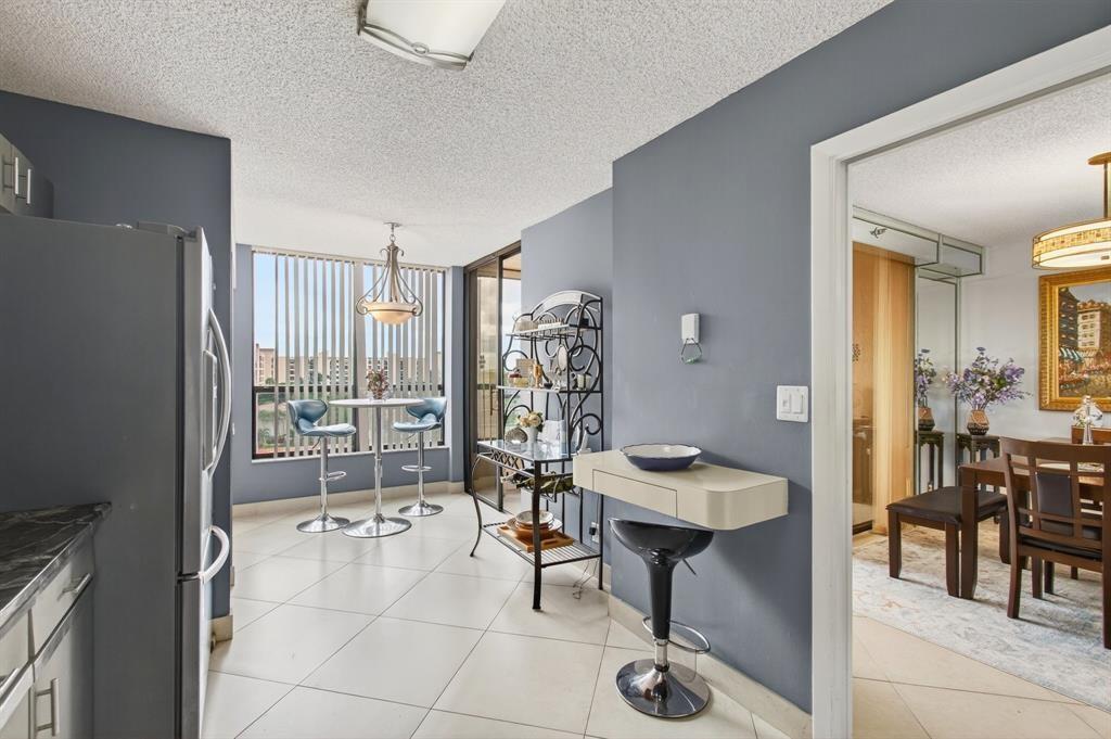 7145 Promenade Drive, Unit 602 Boca Raton, FL 33433 - Photo 34 of 90 a room with furniture and a large window