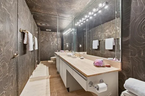 a view of swimming pool with a garden and plants