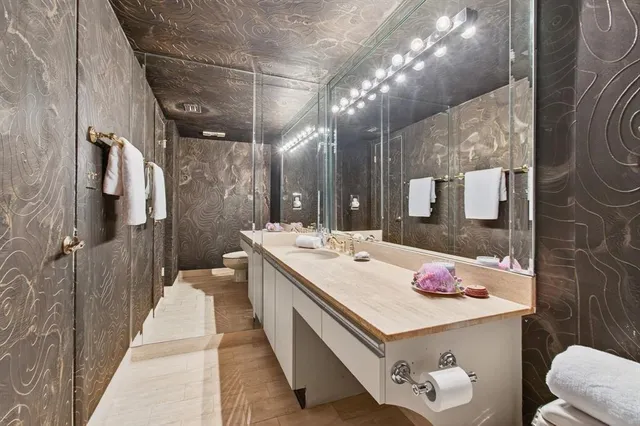 a view of swimming pool with a garden and plants