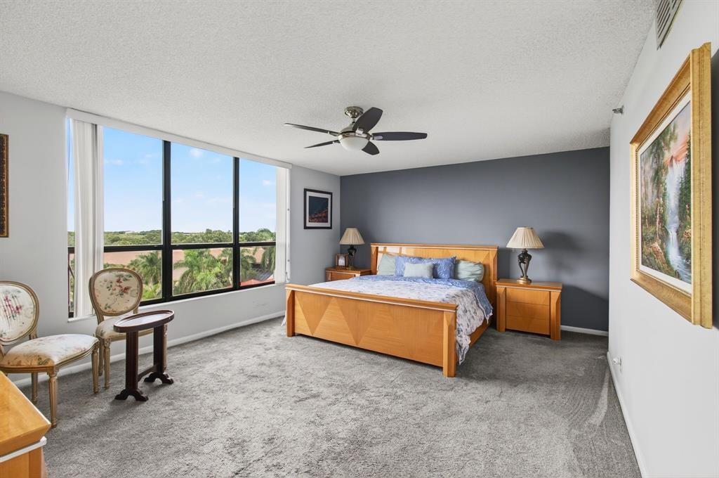 7145 Promenade Drive, Unit 602 Boca Raton, FL 33433 - Photo 39 of 90 a living room with furniture and a large window