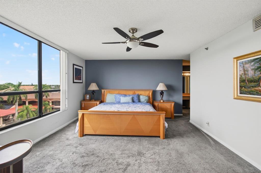 7145 Promenade Drive, Unit 602 Boca Raton, FL 33433 - Photo 40 of 90 a bed room with furniture and a window