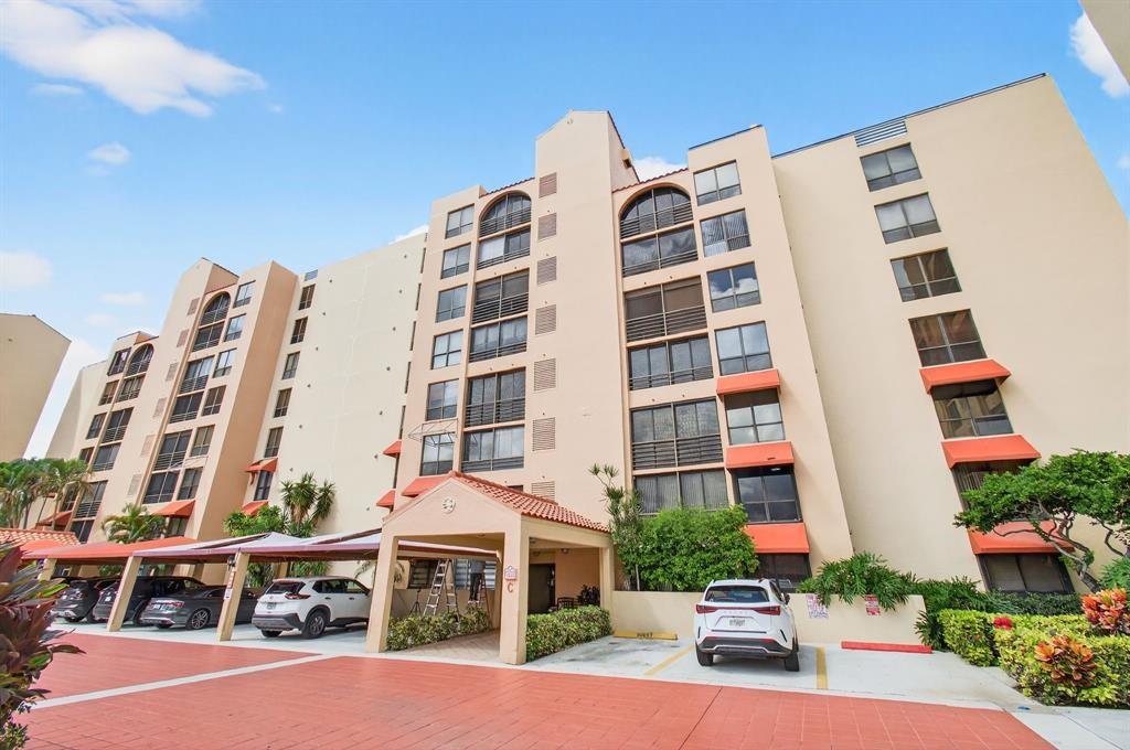 7145 Promenade Drive, Unit 602 Boca Raton, FL 33433 - Photo 5 of 90 a front view of a building with street view