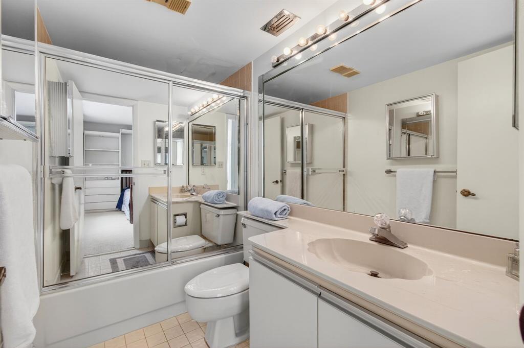 7145 Promenade Drive, Unit 602 Boca Raton, FL 33433 - Photo 52 of 90 a bathroom with a granite countertop sink mirror and double