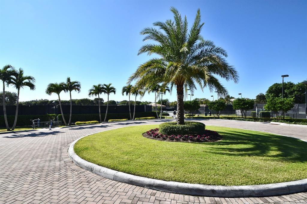 7145 Promenade Drive, Unit 602 Boca Raton, FL 33433 - Photo 90 of 90 a view of a swimming pool with a sitting space