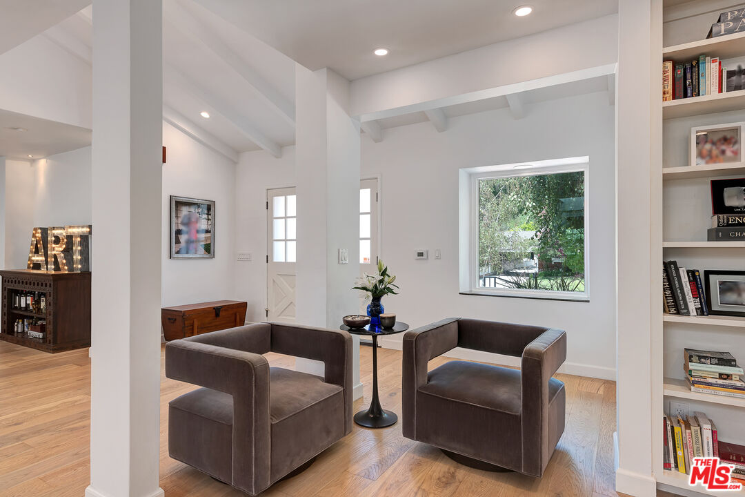 16012 Meadowcrest Road Sherman Oaks, CA 91403 - Photo 11 of 52 a living room with furniture and a window