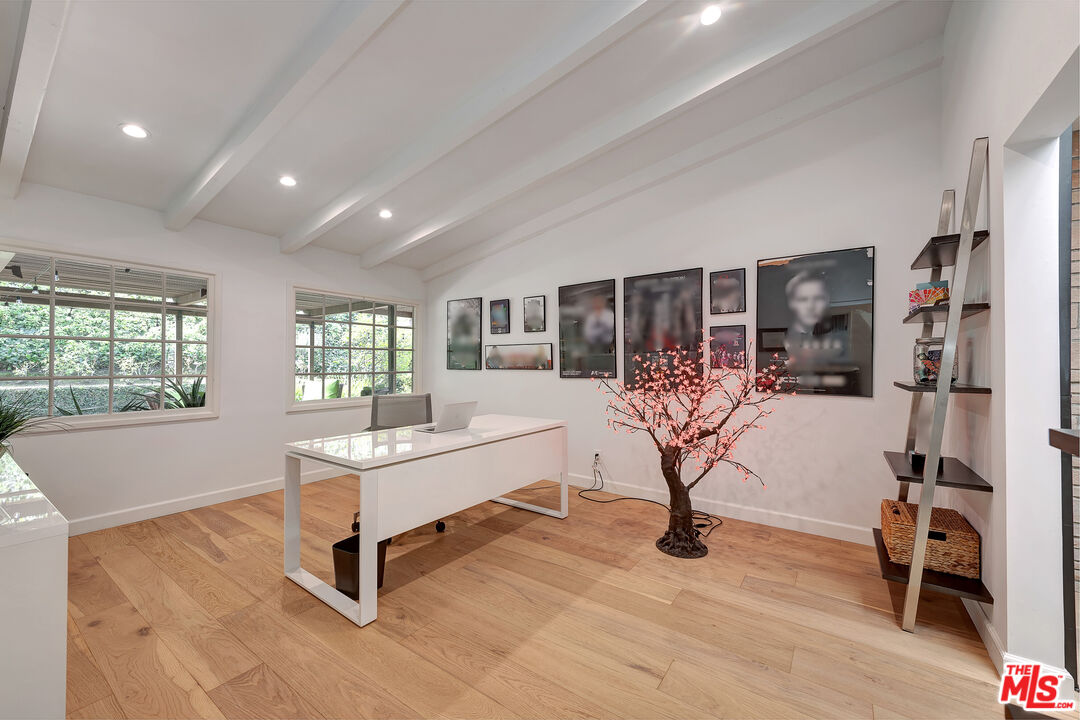 16012 Meadowcrest Road Sherman Oaks, CA 91403 - Photo 21 of 52 a living room with furniture a dining table and a large window