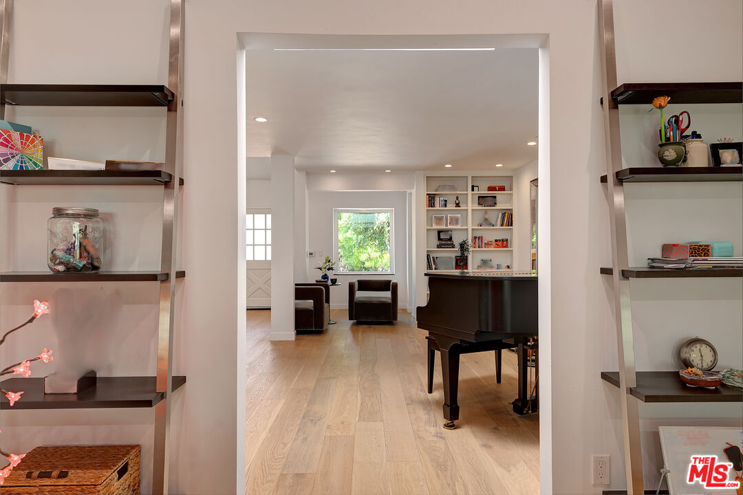 16012 Meadowcrest Road Sherman Oaks, CA 91403 - Photo 22 of 52 a view of a living room and dining room