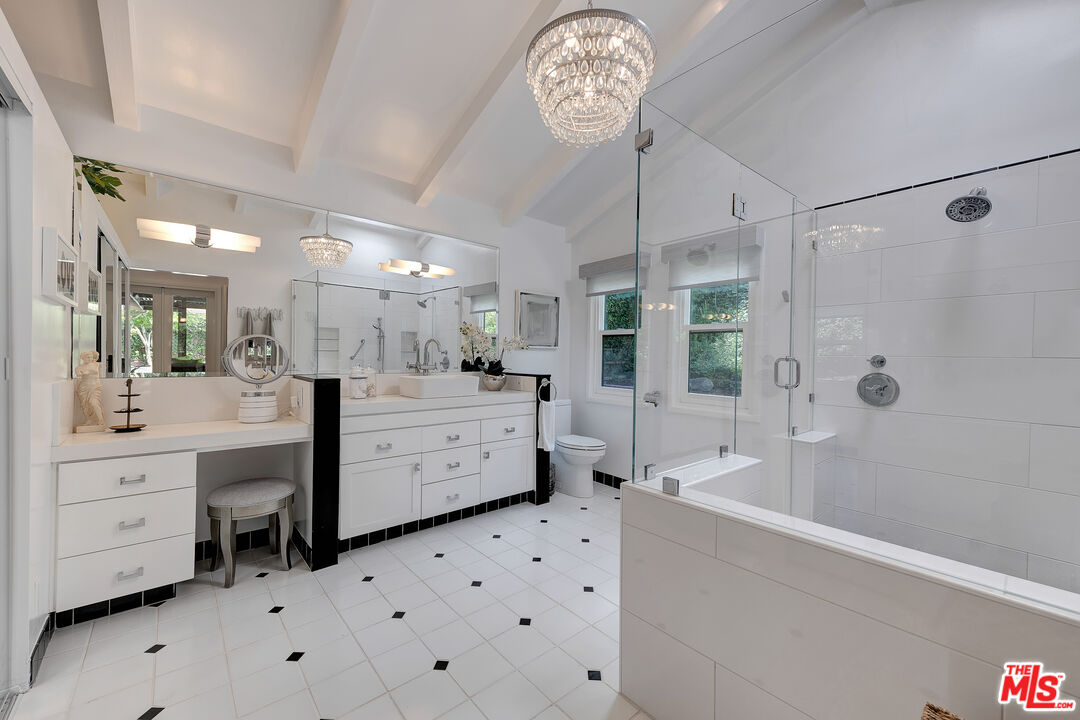 16012 Meadowcrest Road Sherman Oaks, CA 91403 - Photo 25 of 52 a bathroom with a sink a toilet and shower