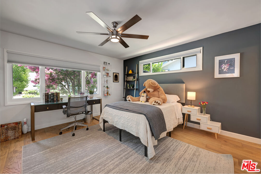 16012 Meadowcrest Road Sherman Oaks, CA 91403 - Photo 28 of 52 a bed room with a bed and a window