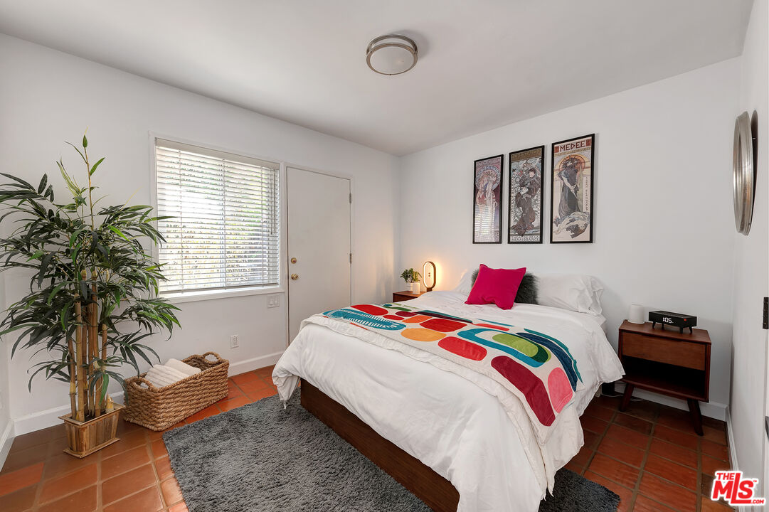 16012 Meadowcrest Road Sherman Oaks, CA 91403 - Photo 30 of 52 a bedroom with bed and furniture