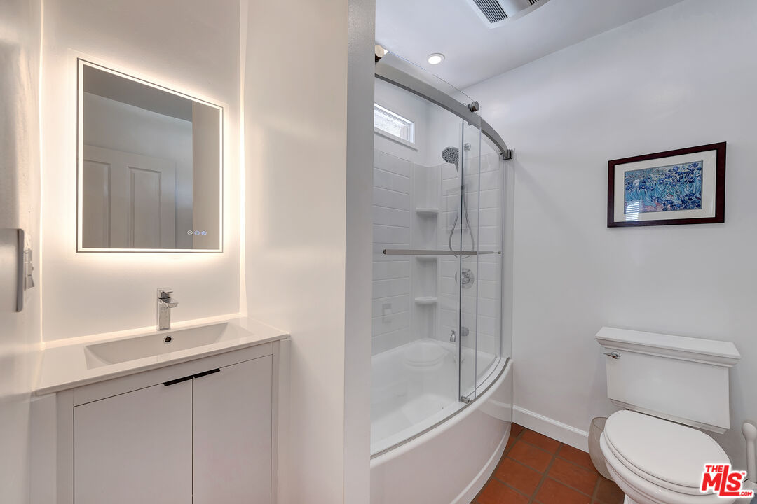 16012 Meadowcrest Road Sherman Oaks, CA 91403 - Photo 31 of 52 a bathroom with a toilet sink and shower