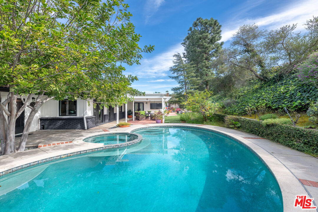 16012 Meadowcrest Road Sherman Oaks, CA 91403 - Photo 39 of 52 a view of pool with lawn chairs yard