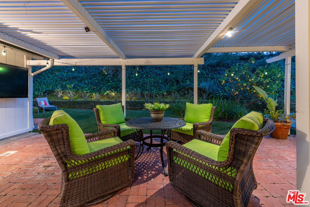 16012 Meadowcrest Road Sherman Oaks, CA 91403 - Photo 47 of 52 a balcony with furniture and a garden