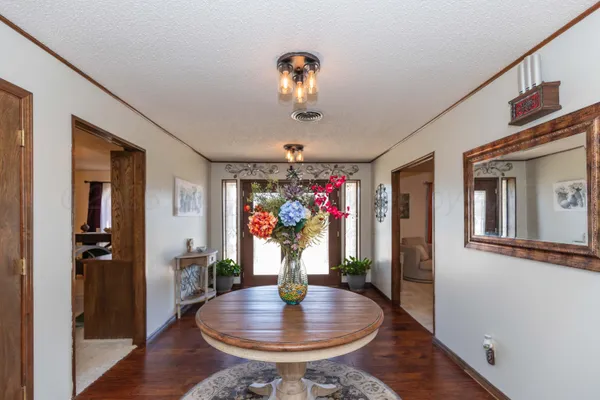 a kitchen with granite countertop a sink stove and refrigerator