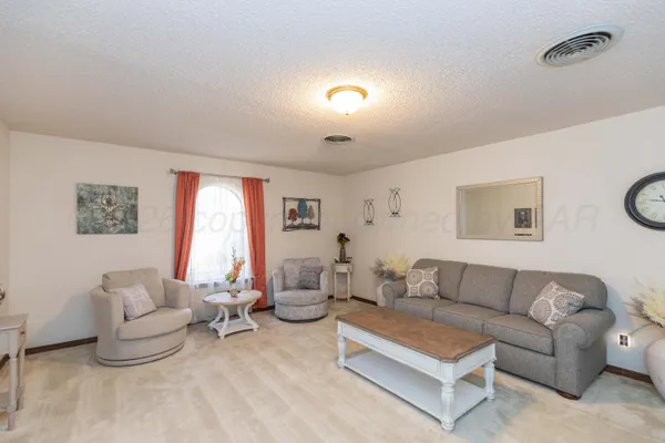 a kitchen that has a table and chairs in it