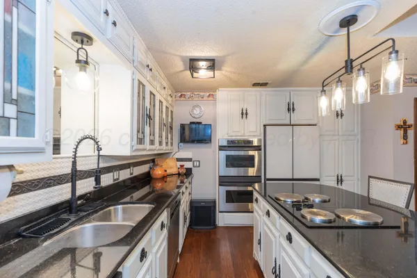 a view of a kitchen center island dining table and chairs