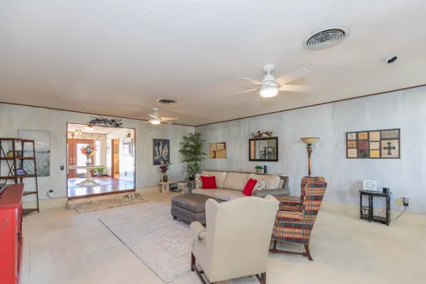 a living room with furniture and a rug