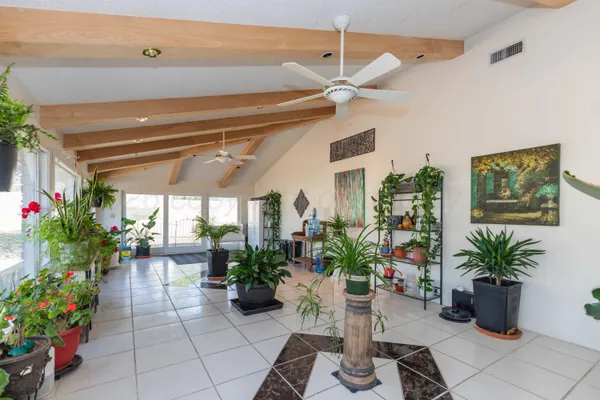 a bathroom with a granite countertop sink mirror vanity and toilet