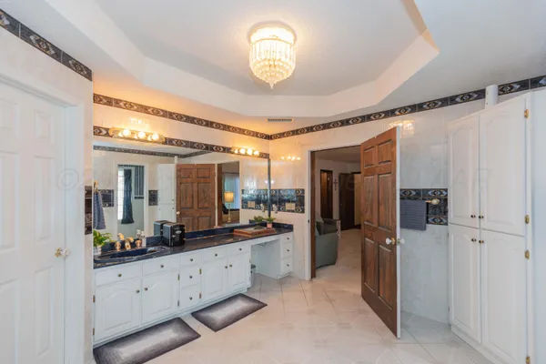 a kitchen with a stove sink and a refrigerator