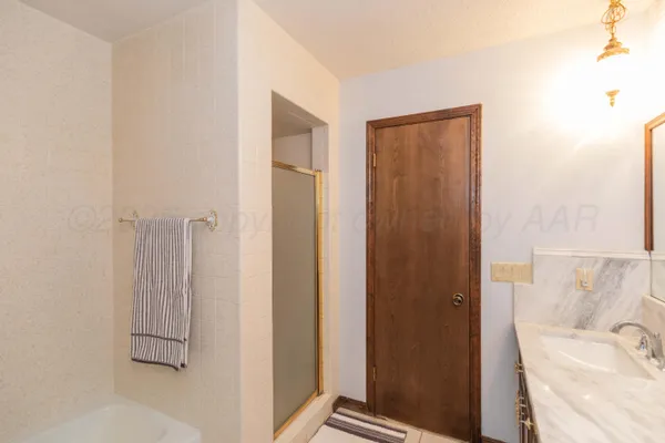 a view of a house with backyard sitting area and garden