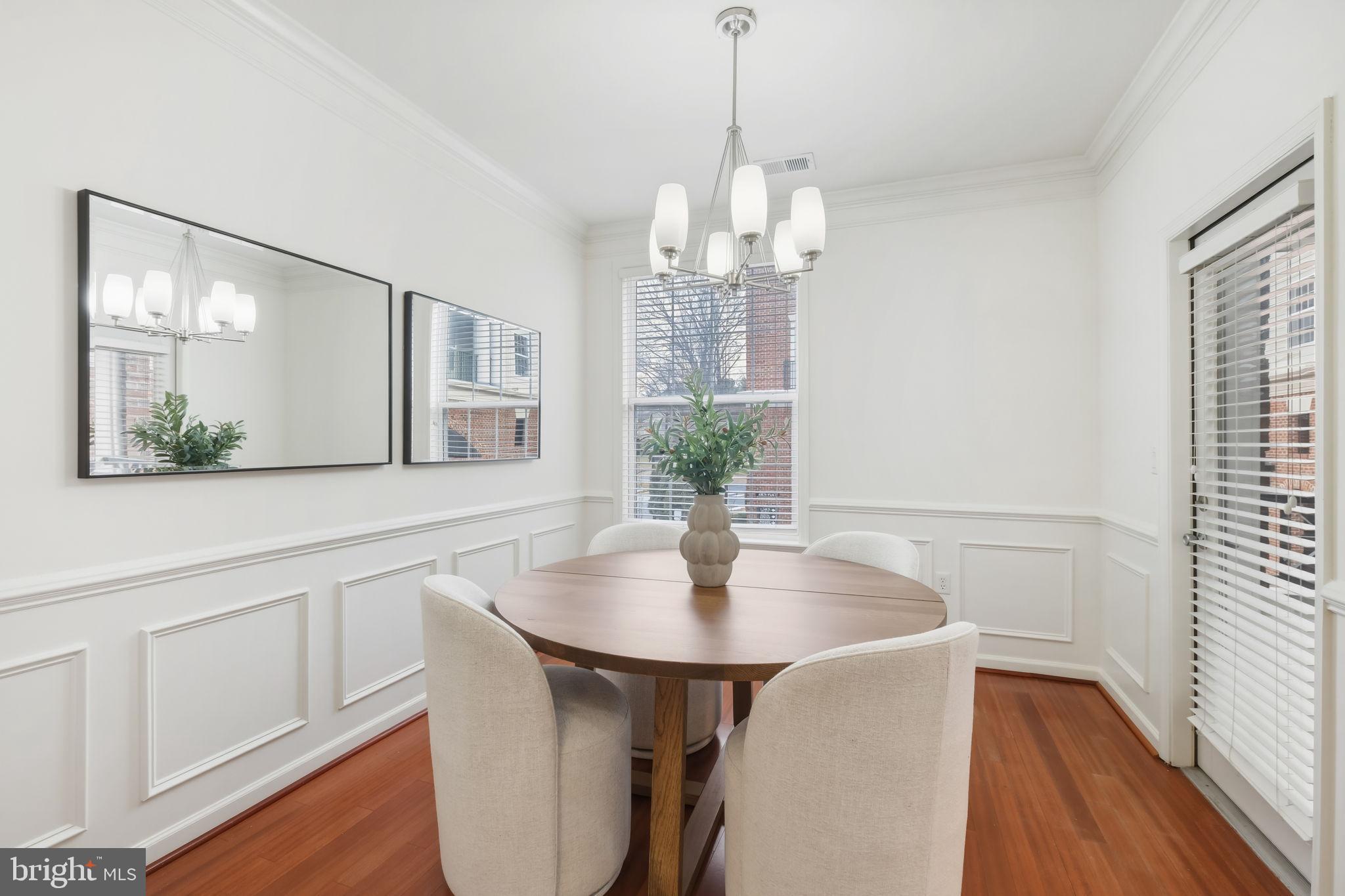 1 Arch Place, Unit 220 Gaithersburg, MD 20878 - Photo 7 of 26 Dining space w/ natural light and door to balcony