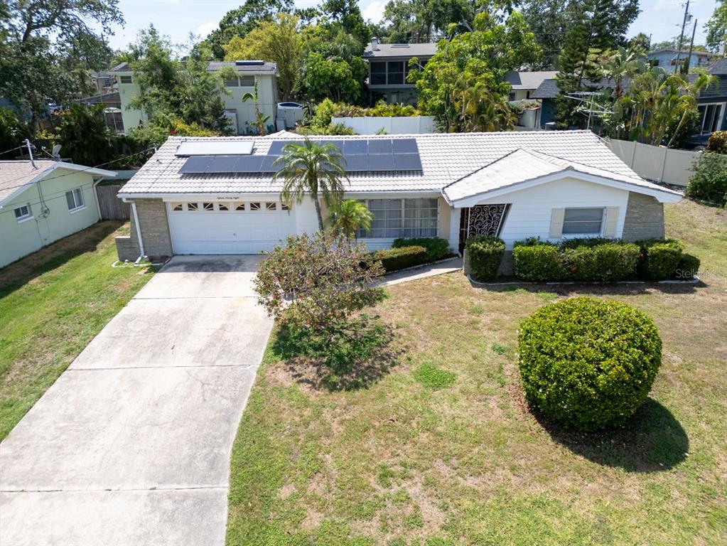 1598 Brookside Boulevard Largo, FL 33770 - Photo 1 of 1 a aerial view of a house with a yard and potted plants