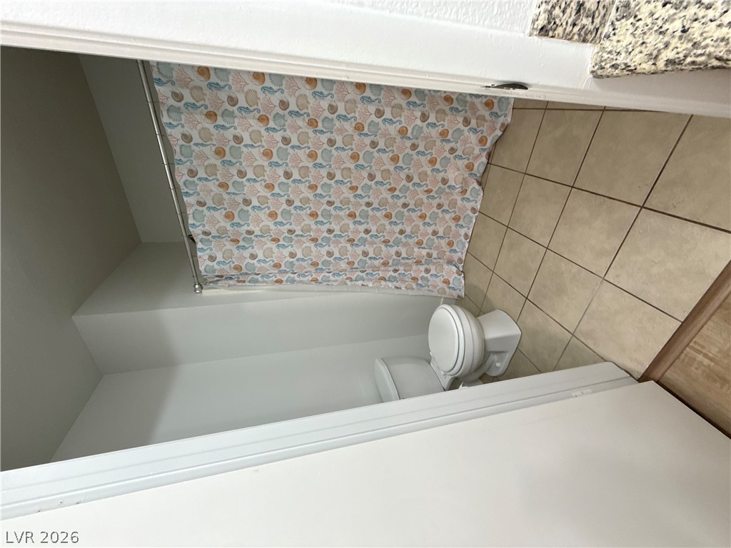 8070 West Russell Road, Unit 1092 Las Vegas, NV 89113 - Photo 3 of 14 Tiled flooring runs throughout this functional bathroom layout.