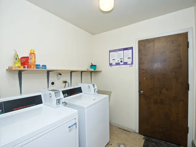 a view of storage and utility room with washer and dryer