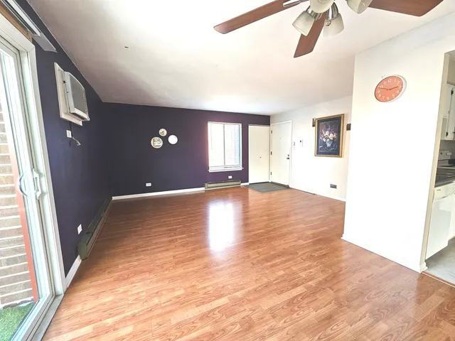 a view of a livingroom with wooden floor