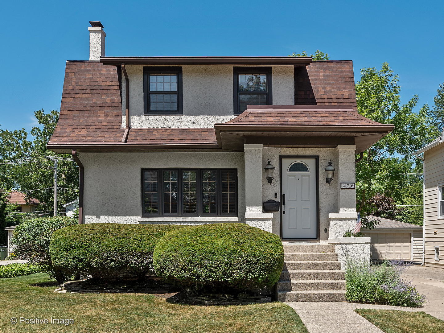 276 Blackhawk Road Riverside, IL 60546 - Photo 1 of 18 a front view of a house with a garden
