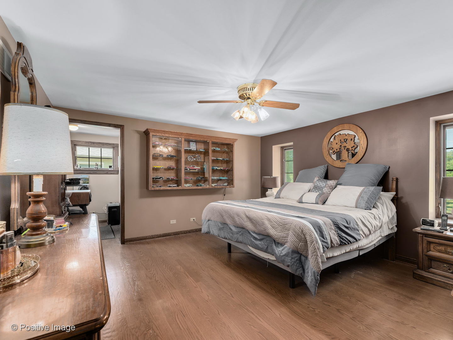 276 Blackhawk Road Riverside, IL 60546 - Photo 11 of 18 a spacious bedroom with a large bed and a chandelier