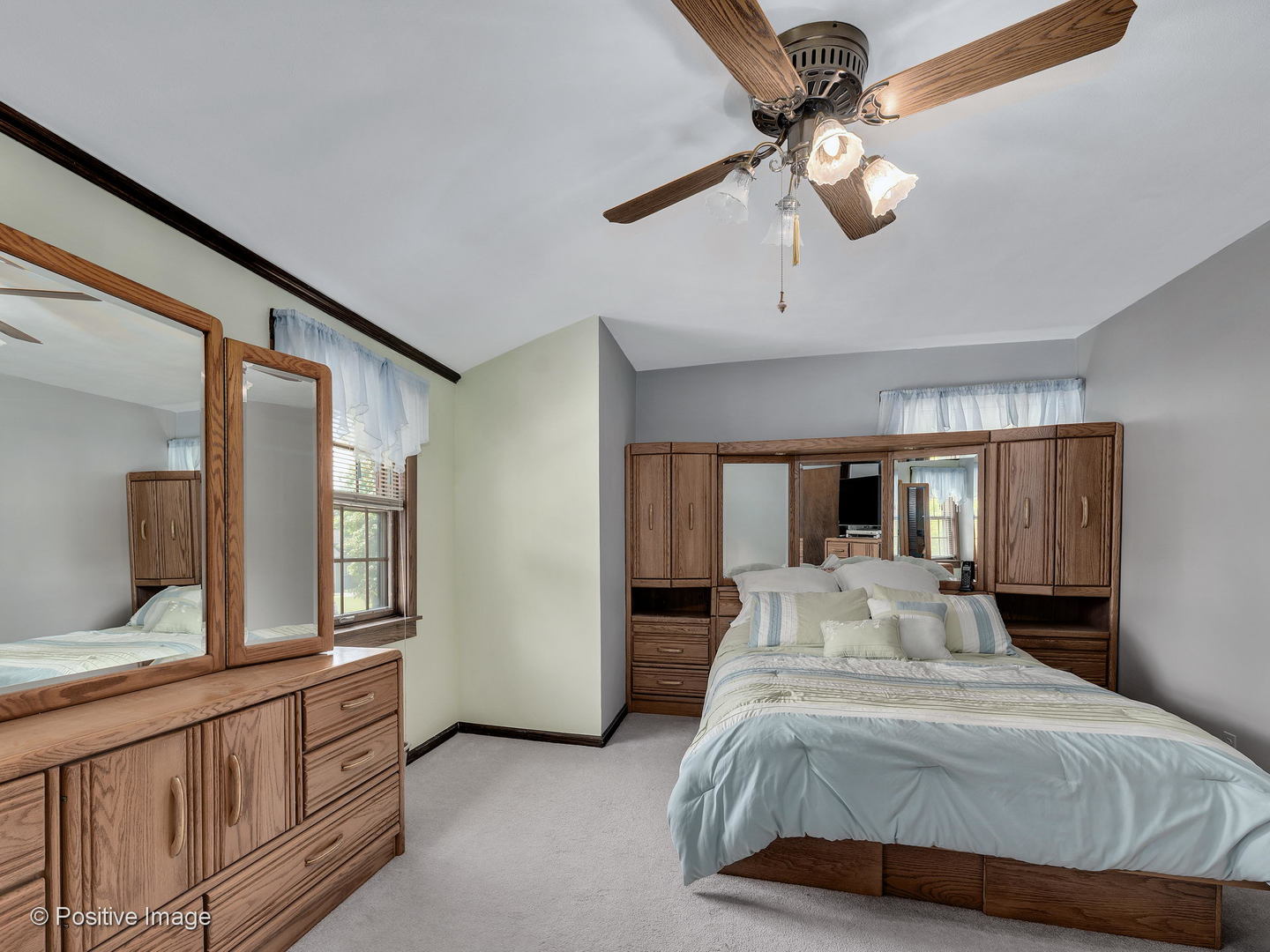 276 Blackhawk Road Riverside, IL 60546 - Photo 14 of 18 a bedroom with a large bed and a chandelier
