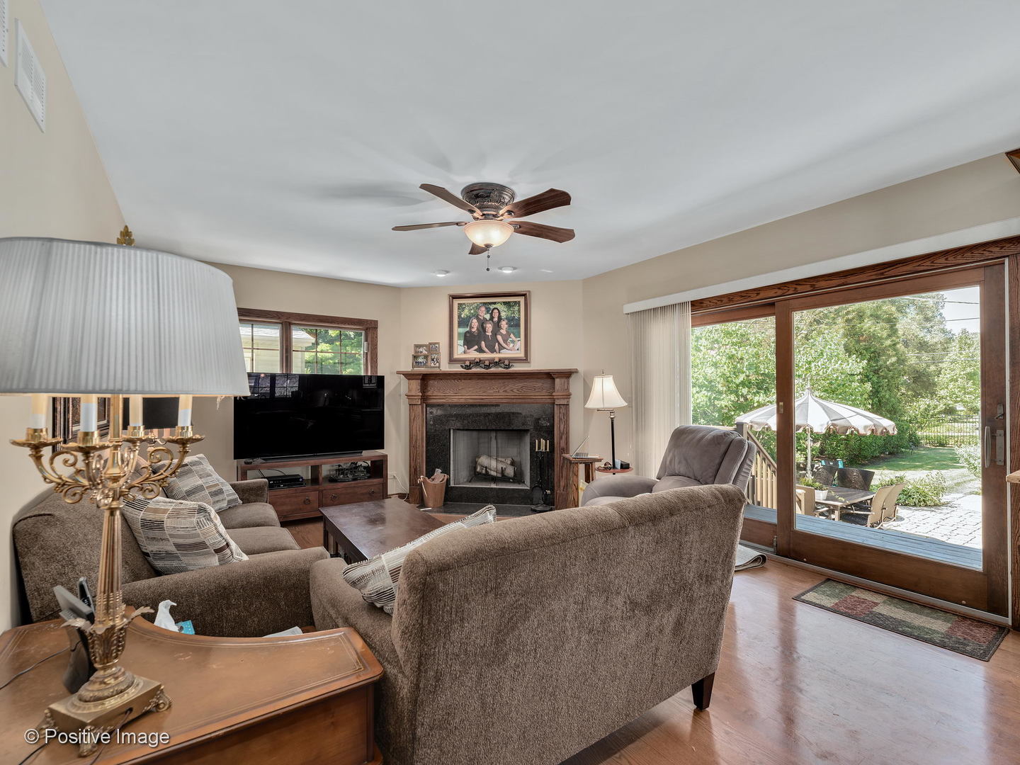 276 Blackhawk Road Riverside, IL 60546 - Photo 6 of 18 a living room with furniture a fireplace and a large window