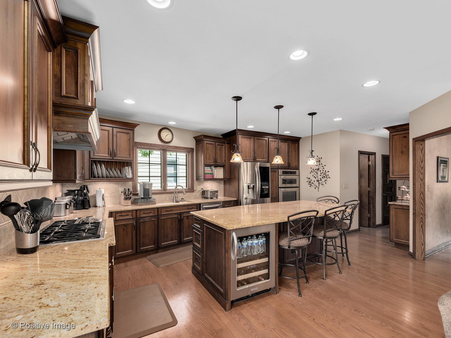 276 Blackhawk Road Riverside, IL 60546 - Photo 7 of 18 a large kitchen with stainless steel appliances granite countertop a stove oven and a refrigerator