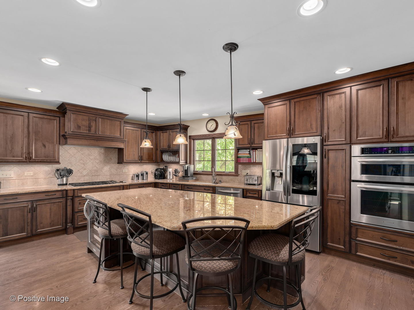 276 Blackhawk Road Riverside, IL 60546 - Photo 8 of 18 a kitchen with stainless steel appliances granite countertop a stove refrigerator sink and cabinets